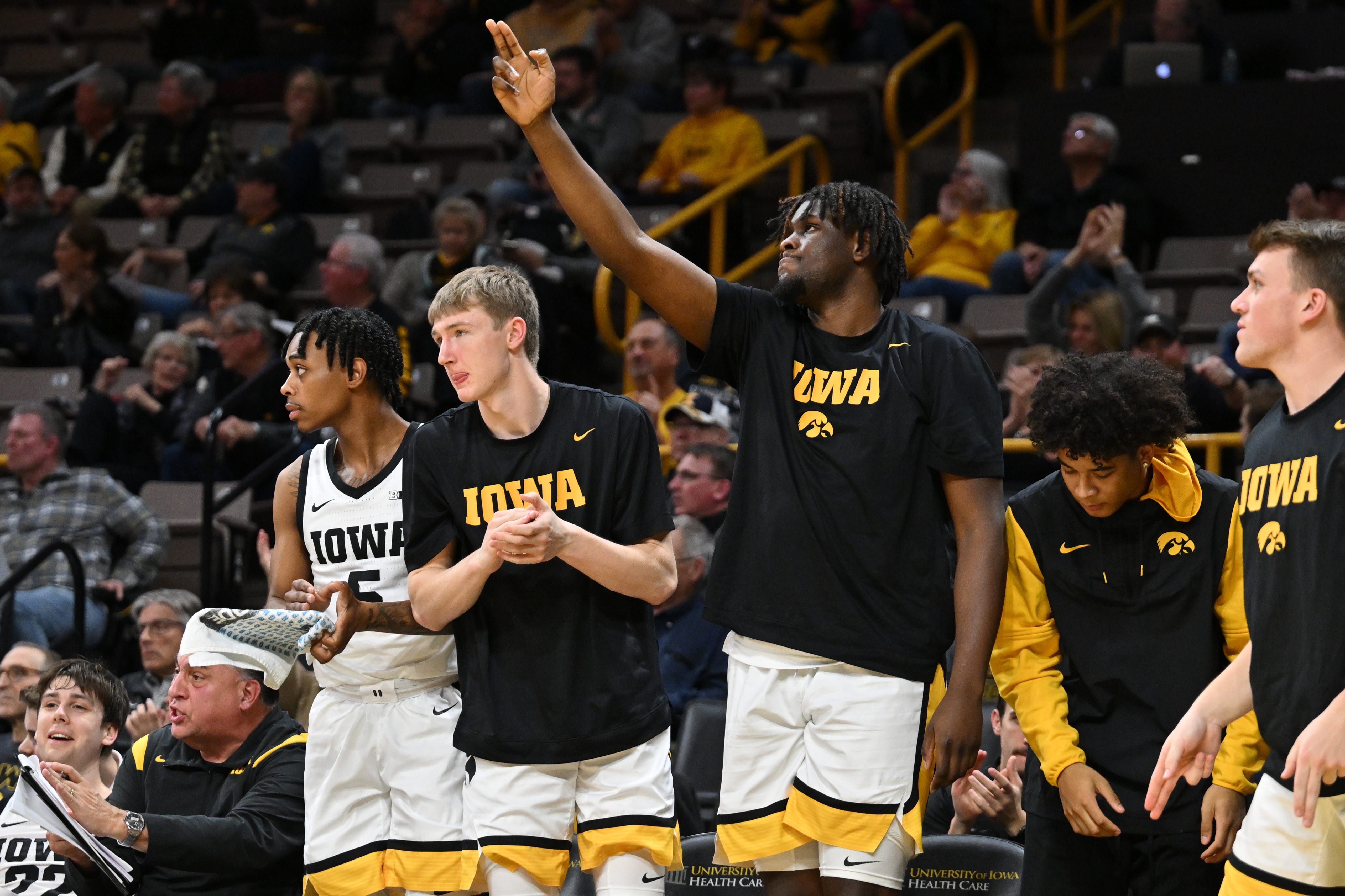 Iowa Hawkeyes players, from left, Dasonte Bowen, Josh Dix, Josh Ogundele and Amarion Nimmers react during the second half of an NCAA college basketball game against Georgia Tech, Tuesday, Nov. 29, 2022, in Iowa City, Iowa.