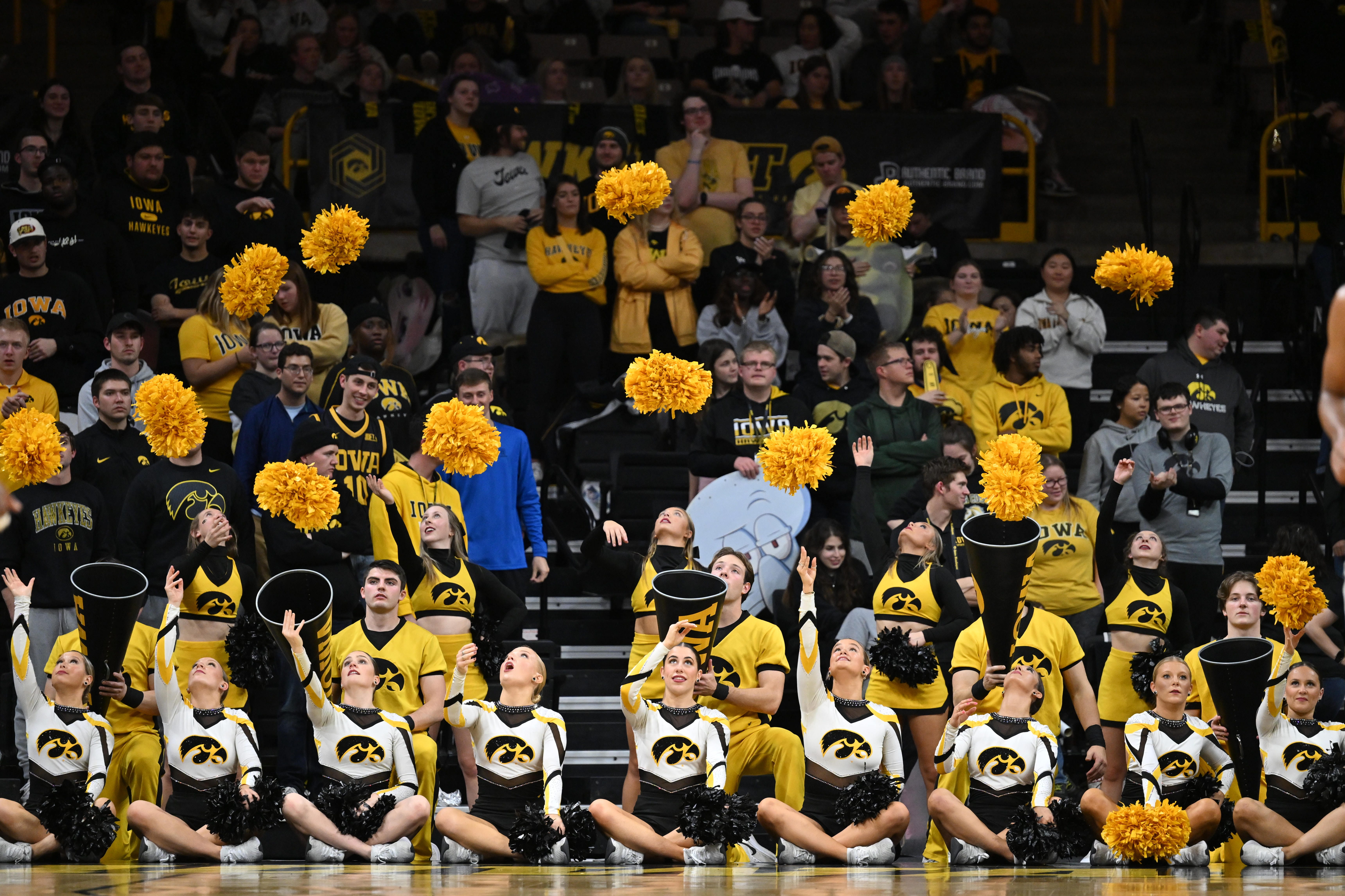Iowa Hawkeyes cheerleaders react during the game against the Georgia Tech Yellow Jackets during the second half of an NCAA college basketball game, Tuesday, Nov. 29, 2022, in Iowa City, Iowa.