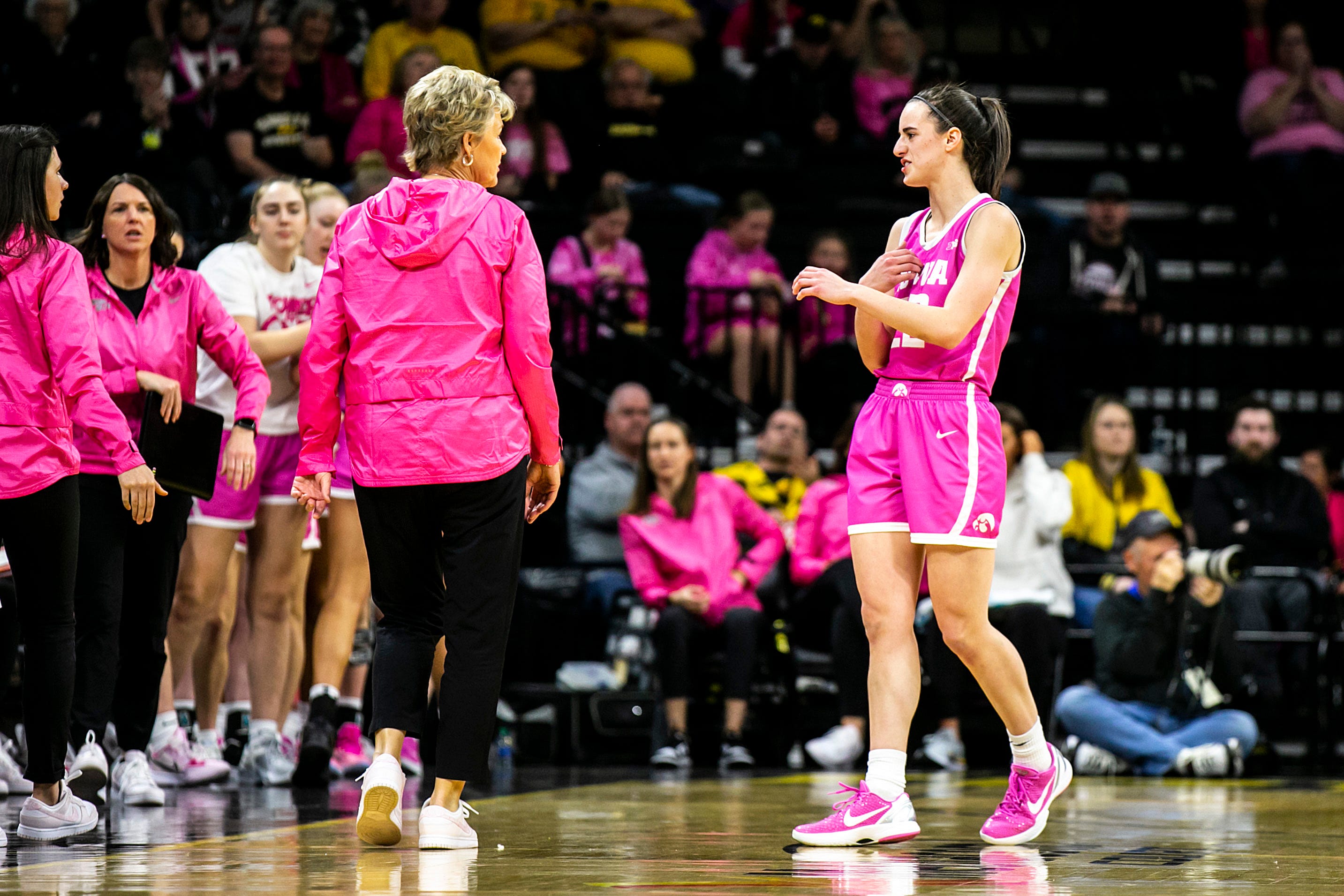 Iowa guard Caitlin Clark, right, talks with head coach Lisa Bluder during a NCAA Big Ten Conference women's basketball game against Rutgers, Sunday, Feb. 12, 2023, at Carver-Hawkeye Arena in Iowa City, Iowa.