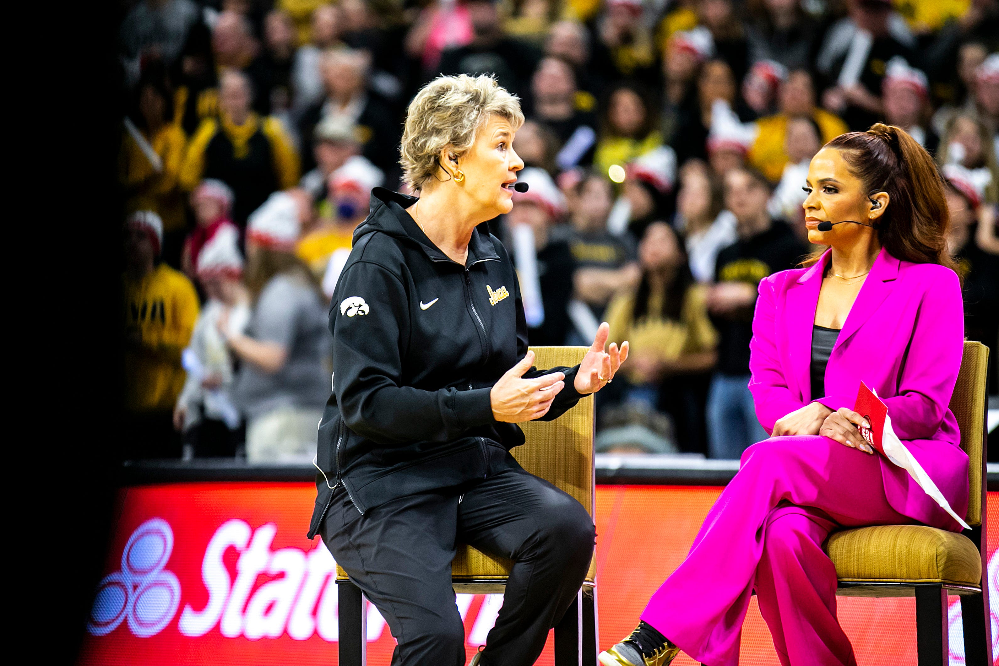 Iowa head coach Lisa Bluder, left, is interviewed during a broadcast of ESPN 'College GameDay' before a NCAA Big Ten Conference women's basketball game between Iowa and Indiana, Sunday, Feb. 26, 2023, at Carver-Hawkeye Arena in Iowa City, Iowa.