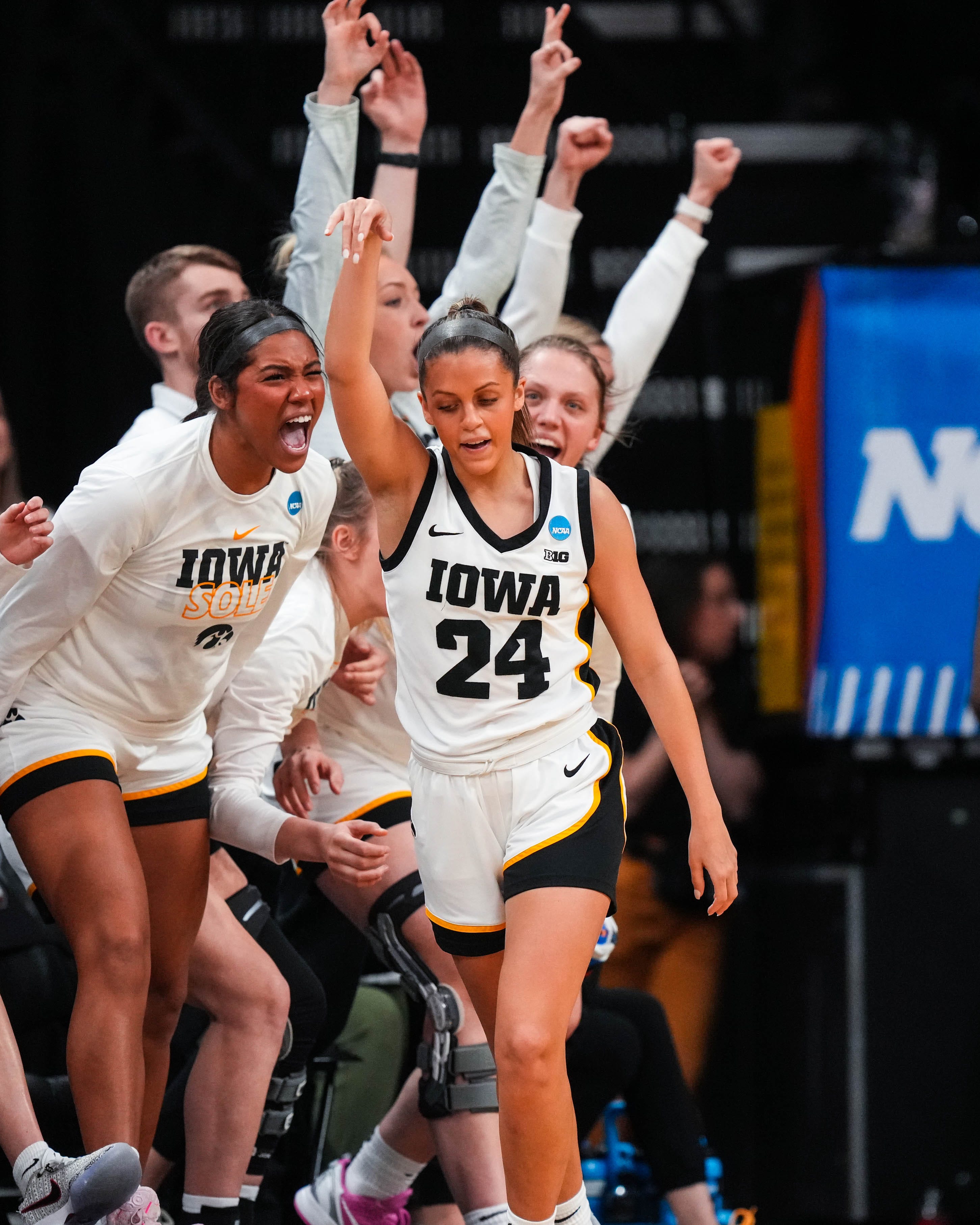 Iowa guard Gabbie Marshall (24) and the bench celebrate a made three pointer during the second round of the NCAA Tournament in Carver-Hawkeye Arena on Sunday, March 19, 2023.