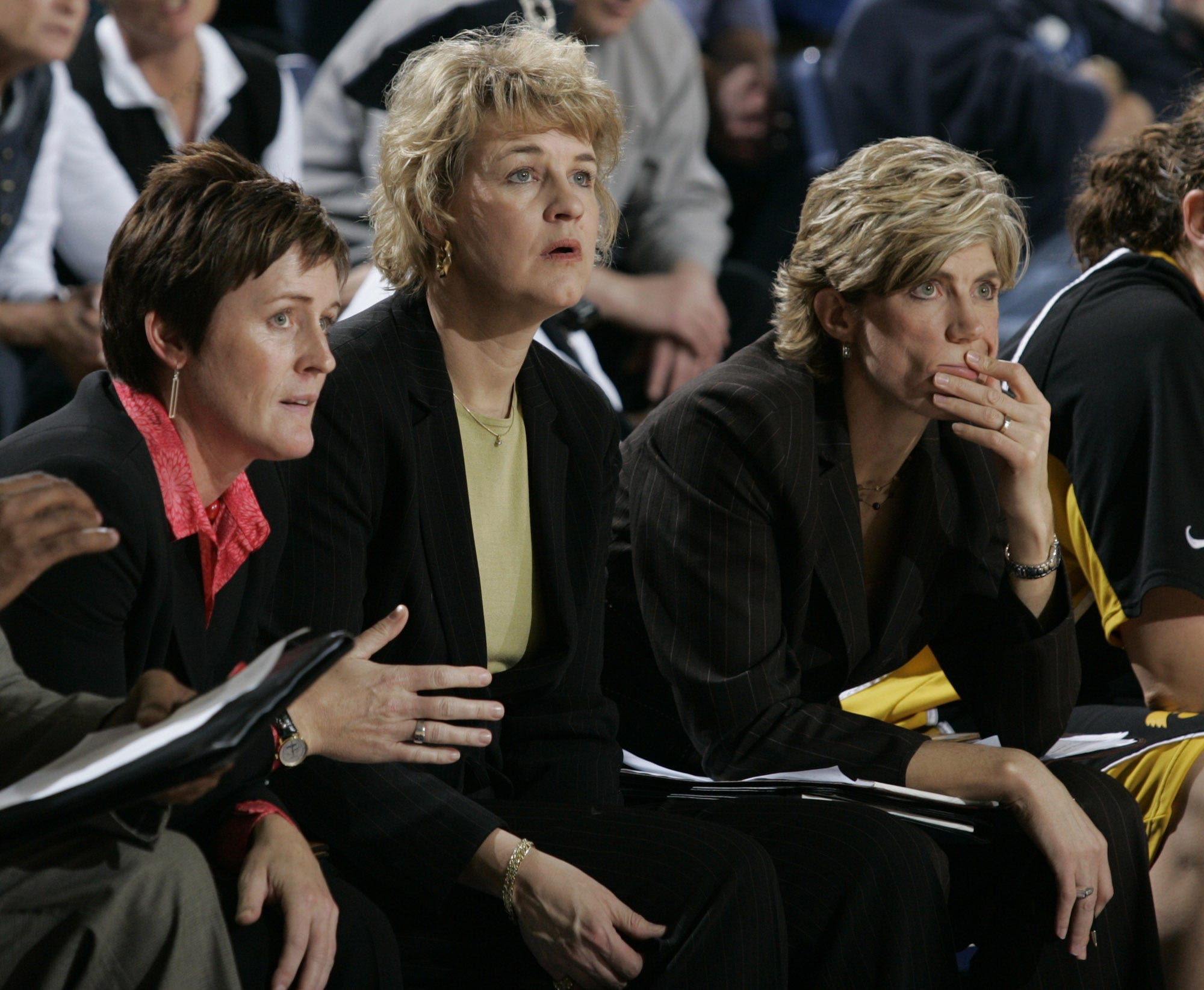 2006: Iowa coach Lisa Bluder is flanked by assistant Jenni Fitzgerald, left, and associate head coach Jan Jensen as they watch play develop against Drake.