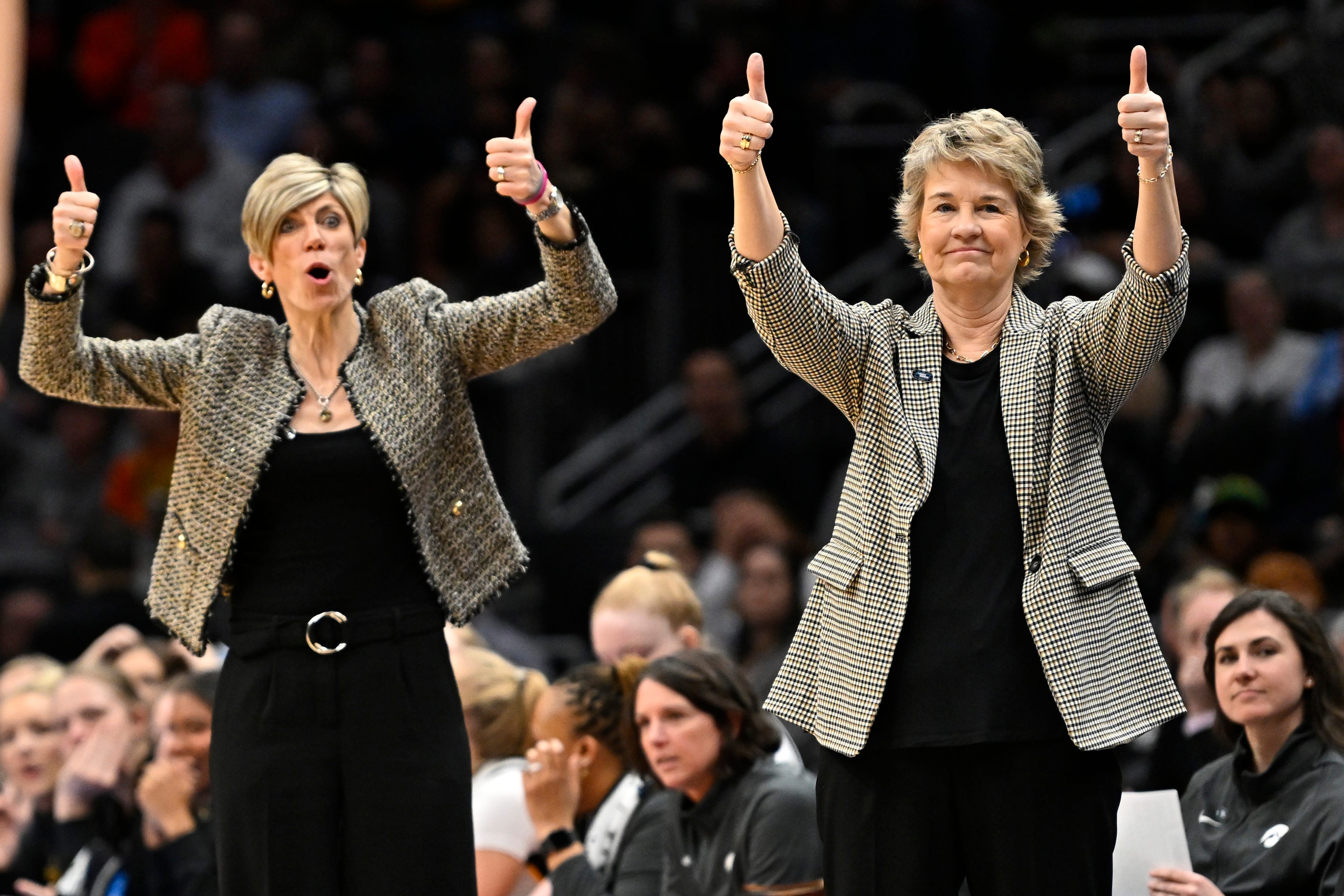Iowa associate head coach Jan Jensen, left, and head coach Lisa Bluder advocate for a jump ball call during the fourth quarter against the Louisville Cardinals in the Elite Eight round of the NCAA Women's Basketball Tournament, March 26, 2023, at Climate Pledge Arena in Seattle.